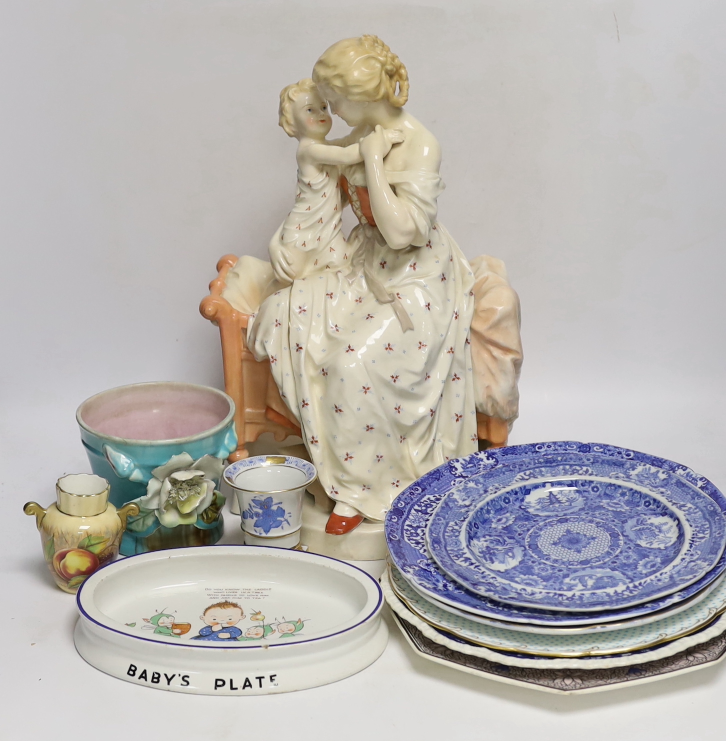 A large French porcelain seated ‘mother and child’ group , a collection of 19th century blue and white pottery plates, a Mabel Lucy Attwell oval dish, a Herend pot, an Aynsley vase, etc.